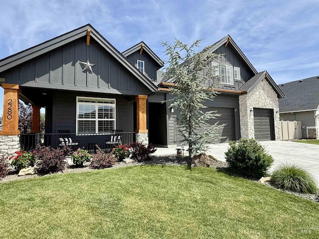 2280 N Burnam Ave, Star, ID 83669 - craftsman-style home featuring board and batten siding, stone siding, a porch, concrete driveway, and a front yard