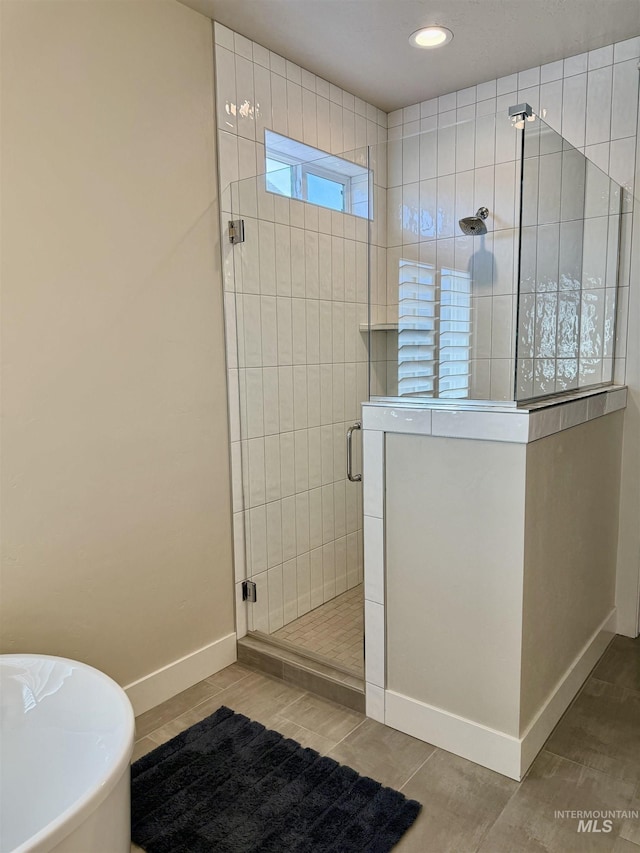 2280 N Burnam Ave, Star, ID 83669 - full bathroom with baseboards, a shower stall, a freestanding bath, and recessed lighting
