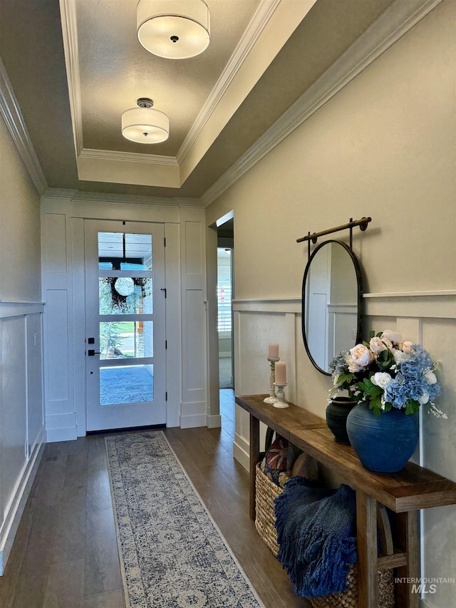 2280 N Burnam Ave, Star, ID 83669 - foyer entrance featuring a raised ceiling, a decorative wall, dark wood-style flooring, crown molding, and a wainscoted wall