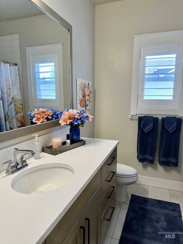 2280 N Burnam Ave, Star, ID 83669 - full bathroom with tile patterned flooring, vanity, toilet, and a shower with curtain