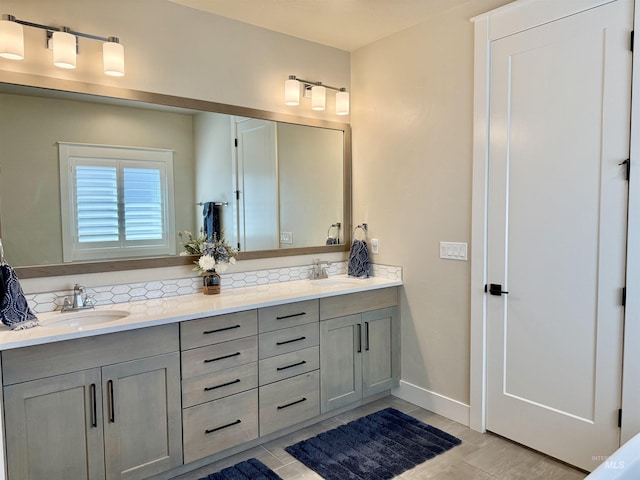 2280 N Burnam Ave, Star, ID 83669 - bathroom featuring double vanity, decorative backsplash, baseboards, and wood finished floors