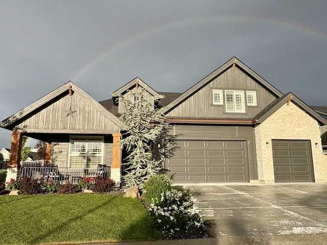 2280 N Burnam Ave, Star, ID 83669 - craftsman house with driveway, a porch, a garage, and a front yard