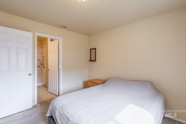 bedroom with carpet floors and visible vents