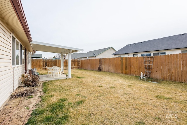 view of yard with a patio area and a fenced backyard