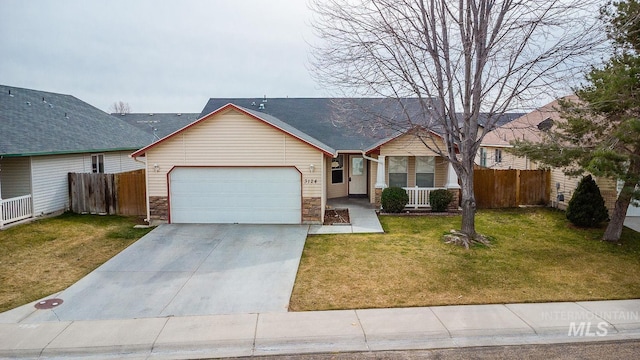 ranch-style house with a front yard, concrete driveway, fence, and an attached garage