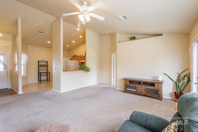 living room featuring light carpet, baseboards, visible vents, and recessed lighting