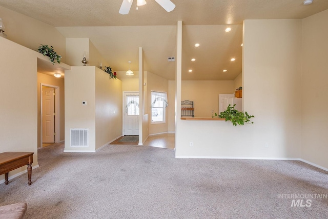 empty room with recessed lighting, light colored carpet, visible vents, ceiling fan, and baseboards