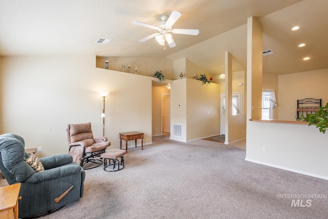 sitting room with ceiling fan, recessed lighting, carpet flooring, visible vents, and vaulted ceiling