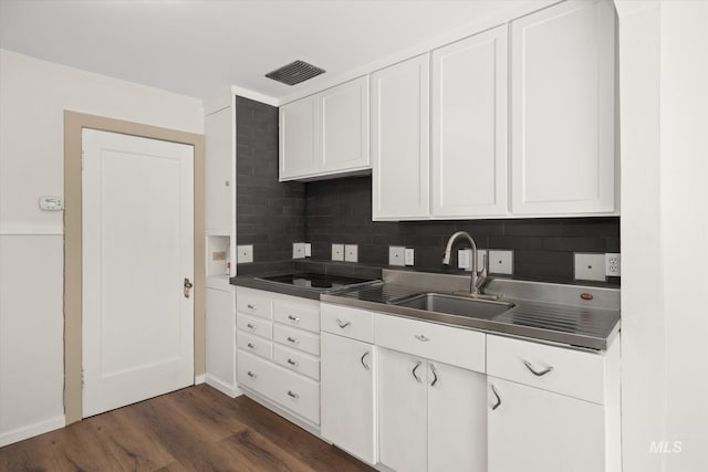 1806 N 28th St, Boise, ID 83703 - kitchen featuring stainless steel countertops, black electric cooktop, dark wood-type flooring, white cabinets, and backsplash