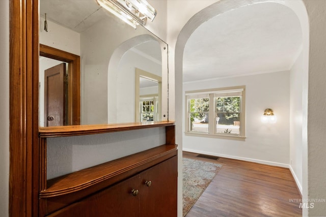 1806 N 28th St, Boise, ID 83703 - hall with wood finished floors, arched walkways, baseboards, and ornamental molding