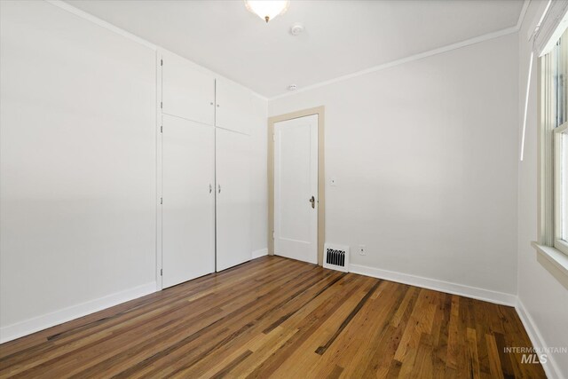 1806 N 28th St, Boise, ID 83703 - unfurnished room with wood finished floors, baseboards, and crown molding