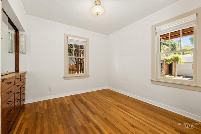1806 N 28th St, Boise, ID 83703 - unfurnished room with ornamental molding, baseboards, and wood finished floors