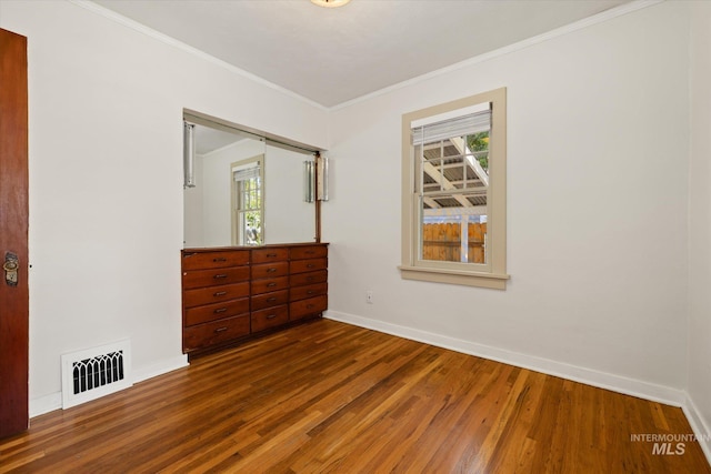 1806 N 28th St, Boise, ID 83703 - empty room with wood finished floors, ornamental molding, and baseboards