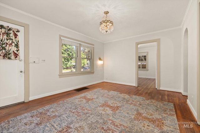 1806 N 28th St, Boise, ID 83703 - empty room with crown molding, wood finished floors, baseboards, and a chandelier