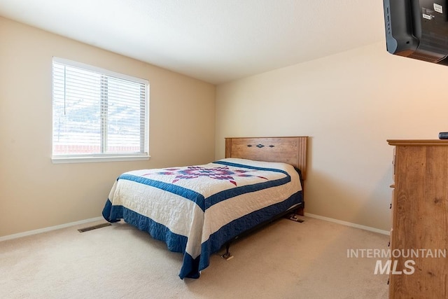 carpeted bedroom with baseboards