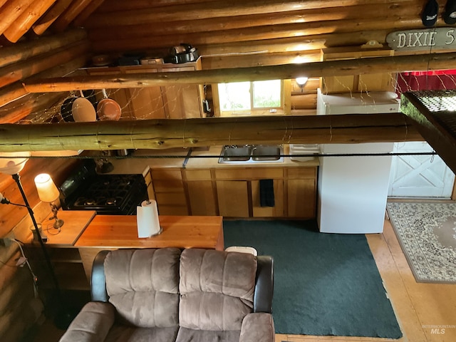 2771 Dixie Rd, Dixie, ID 83525 - kitchen with rustic walls and stove