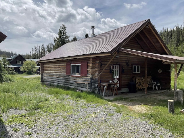 2771 Dixie Rd, Dixie, ID 83525 - back of property featuring log siding and a metal roof