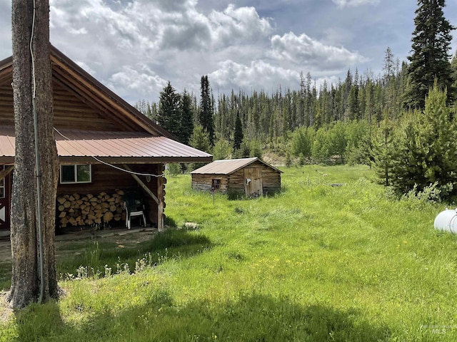 2771 Dixie Rd, Dixie, ID 83525 - view of yard featuring an outdoor structure and a view of trees