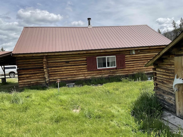2771 Dixie Rd, Dixie, ID 83525 - view of side of property featuring log exterior and a metal roof