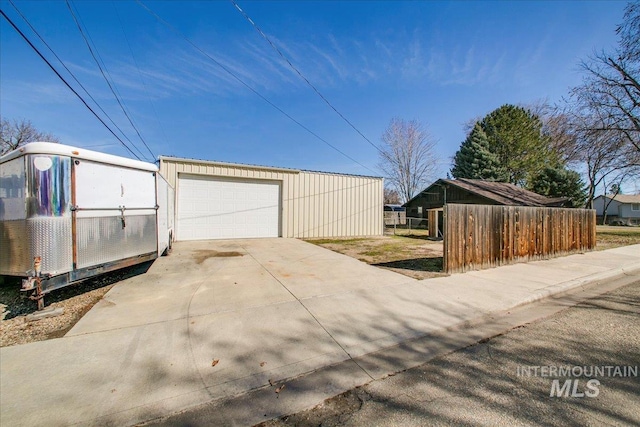 detached garage with fence