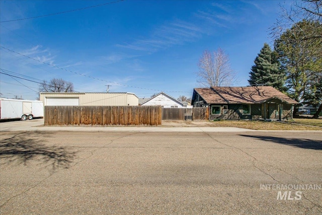 exterior space with a fenced front yard