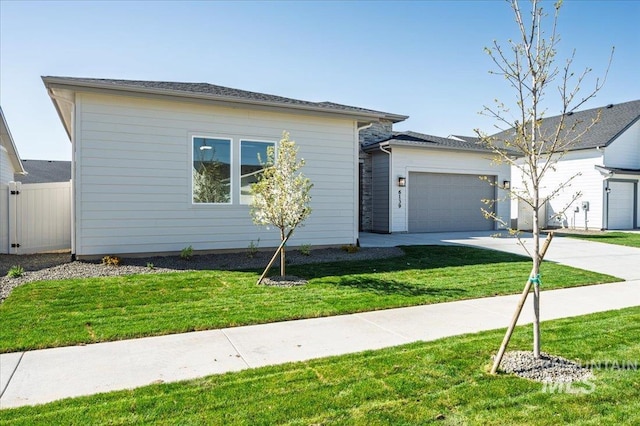 6139 W Burnt Sage Dr, Meridian, ID 83646 - view of front of property featuring concrete driveway, a front yard, fence, and an attached garage