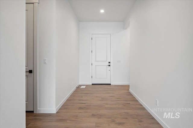 6139 W Burnt Sage Dr, Meridian, ID 83646 - hall featuring baseboards, recessed lighting, and wood finished floors