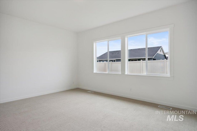 6139 W Burnt Sage Dr, Meridian, ID 83646 - spare room with visible vents, baseboards, and light colored carpet