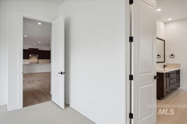 6139 W Burnt Sage Dr, Meridian, ID 83646 - corridor with recessed lighting, baseboards, and a sink