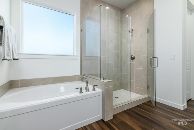 6139 W Burnt Sage Dr, Meridian, ID 83646 - full bathroom with a garden tub, a stall shower, and wood finished floors
