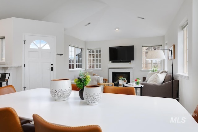 5158 S Surprise Way, Boise, ID 83716 - dining room with a glass covered fireplace, lofted ceiling, and recessed lighting
