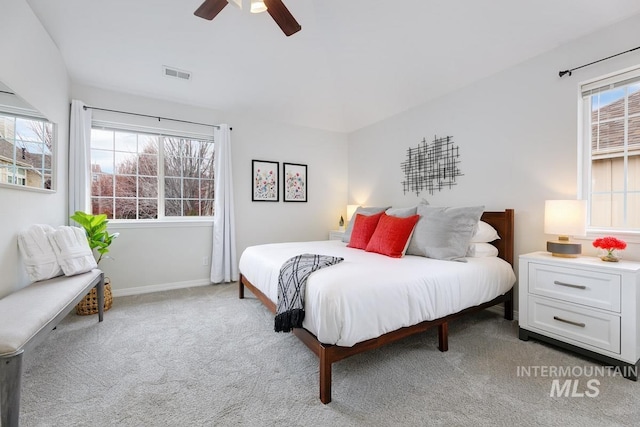 5158 S Surprise Way, Boise, ID 83716 - bedroom with light colored carpet, a ceiling fan, and baseboards