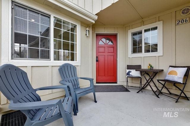 5158 S Surprise Way, Boise, ID 83716 - doorway to property featuring board and batten siding