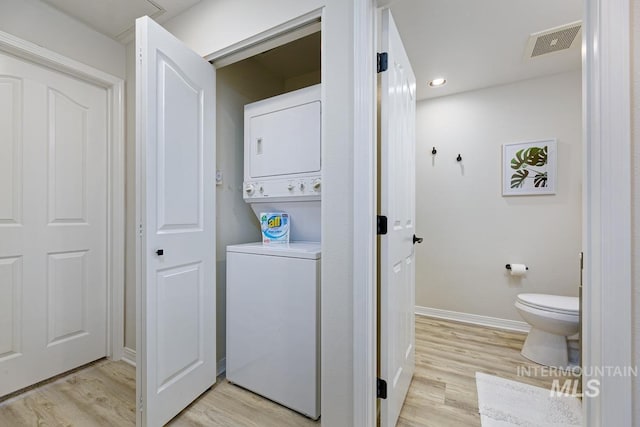 5158 S Surprise Way, Boise, ID 83716 - clothes washing area with stacked washer / drying machine, light wood-style floors, baseboards, and recessed lighting