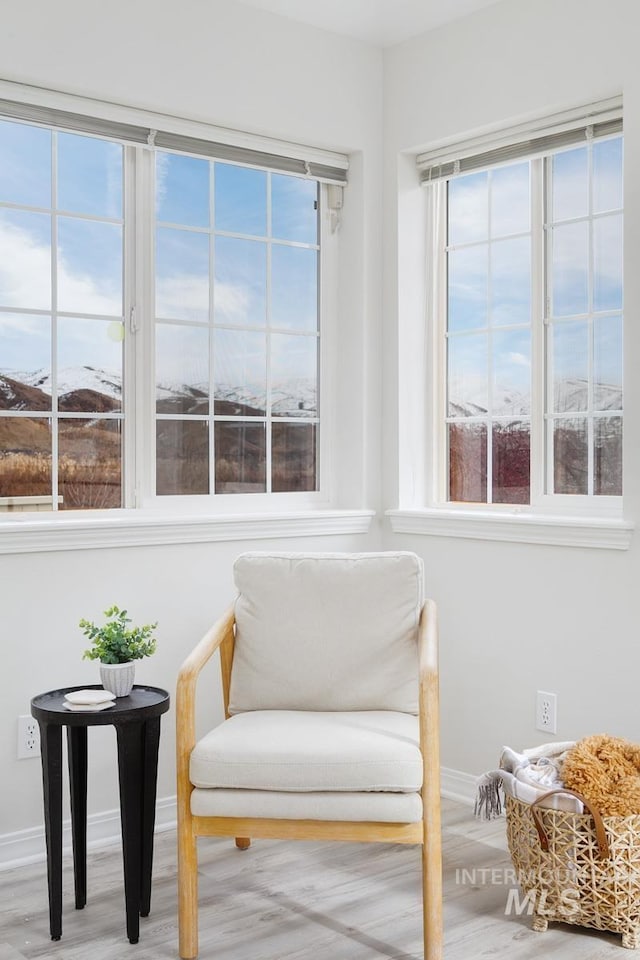 5158 S Surprise Way, Boise, ID 83716 - living area featuring baseboards, healthy amount of natural light, and wood finished floors