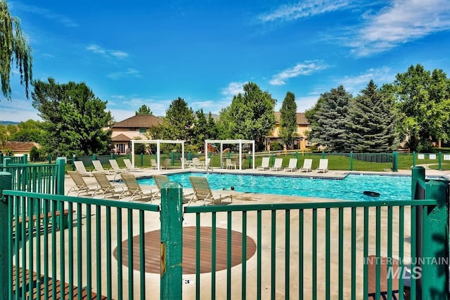 5158 S Surprise Way, Boise, ID 83716 - community pool with fence and a patio