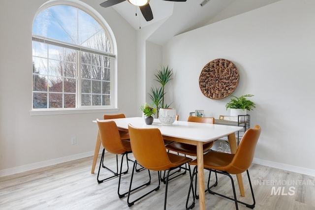 5158 S Surprise Way, Boise, ID 83716 - dining space featuring ceiling fan, vaulted ceiling, light wood-style floors, and baseboards