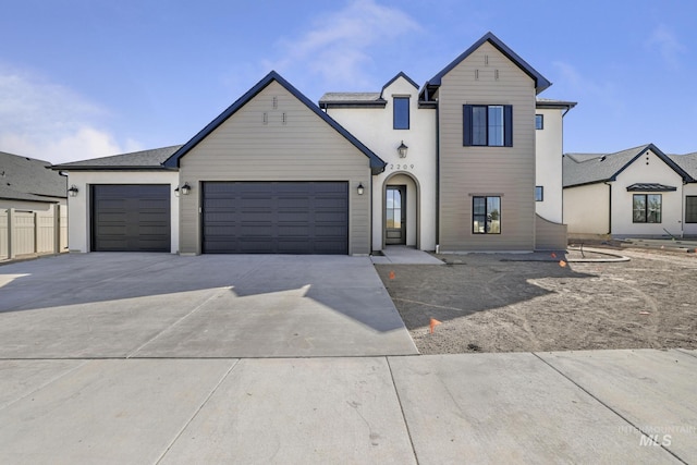 traditional-style home featuring driveway and a garage