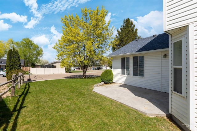 view of yard with a patio and fence
