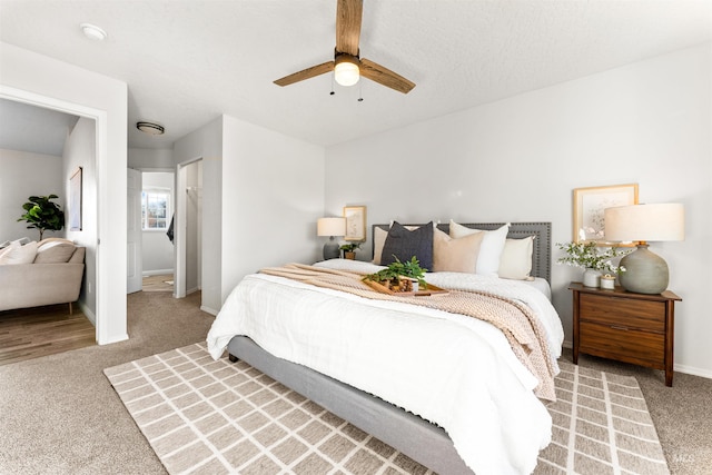 bedroom featuring a ceiling fan, carpet flooring, and baseboards