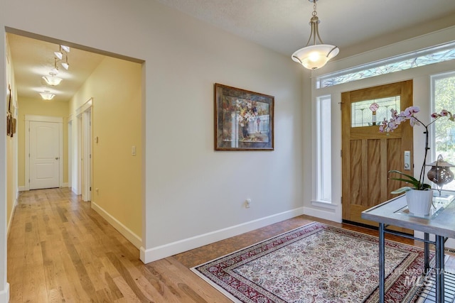 16089 N Basin Way, Boise, ID 83714 - foyer featuring baseboards and light wood finished floors