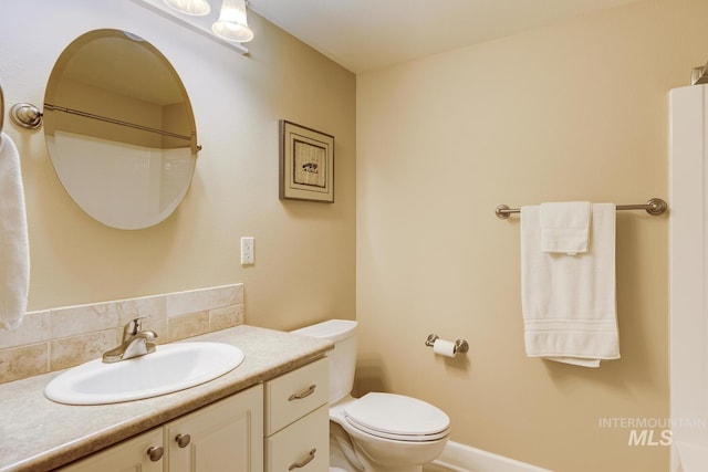 16089 N Basin Way, Boise, ID 83714 - bathroom featuring toilet, vanity, and tasteful backsplash