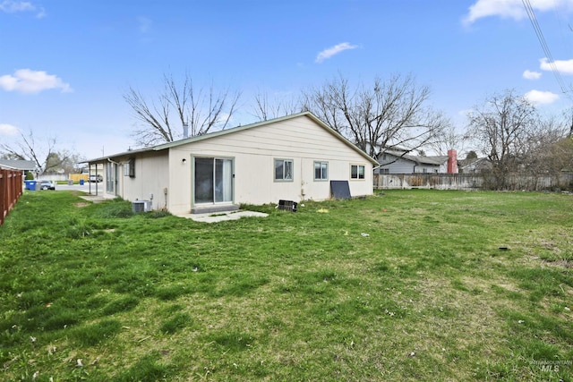 10397 10399 W Irving Ct, Boise, ID 83704 - rear view of house featuring central AC unit, fence, and a yard
