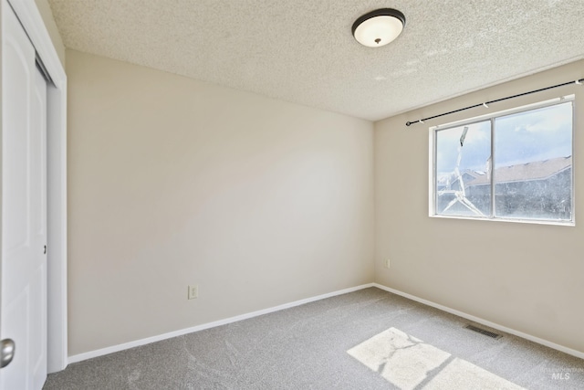 10397 10399 W Irving Ct, Boise, ID 83704 - unfurnished bedroom with baseboards, carpet floors, a textured ceiling, and visible vents