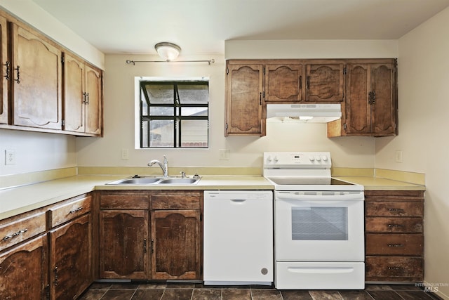 10397 10399 W Irving Ct, Boise, ID 83704 - kitchen with white appliances, light countertops, under cabinet range hood, and a sink