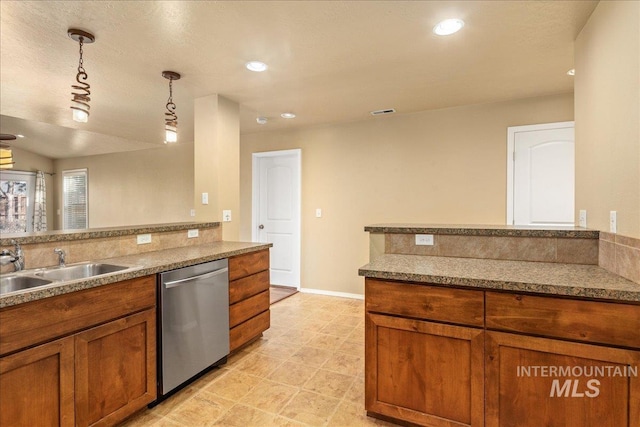 kitchen featuring pendant lighting, recessed lighting, stainless steel dishwasher, brown cabinetry, and a sink