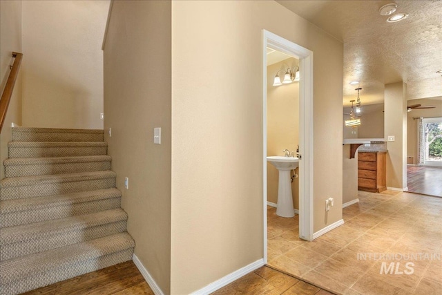 staircase featuring baseboards