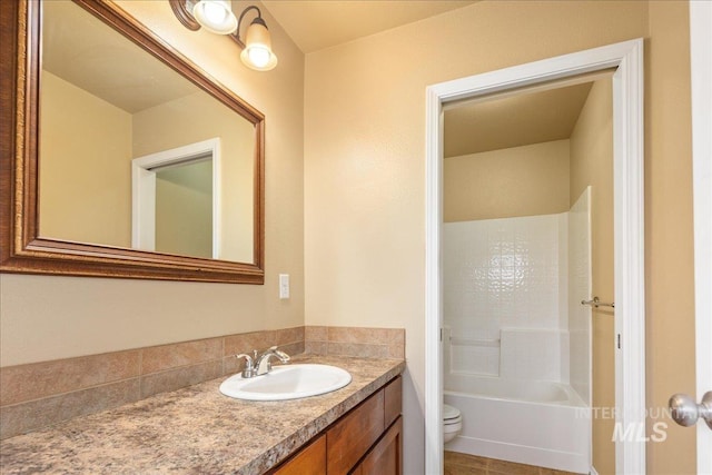 full bath featuring vanity, shower / tub combination, and toilet