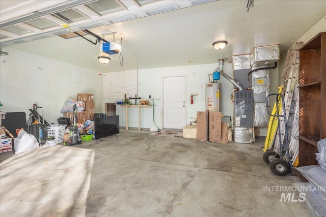 garage featuring gas water heater and a garage door opener