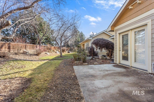 view of yard featuring a patio and fence